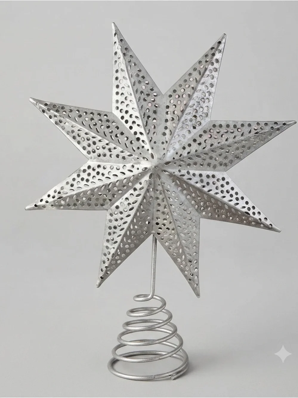 Silver Star Tree Topper Eight-point 3D star with intricate punch-work